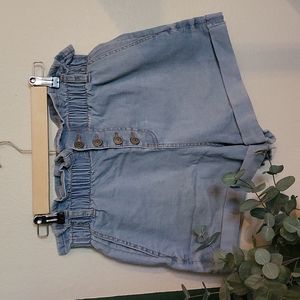 Denim shorts, ruffled waist band with button fly